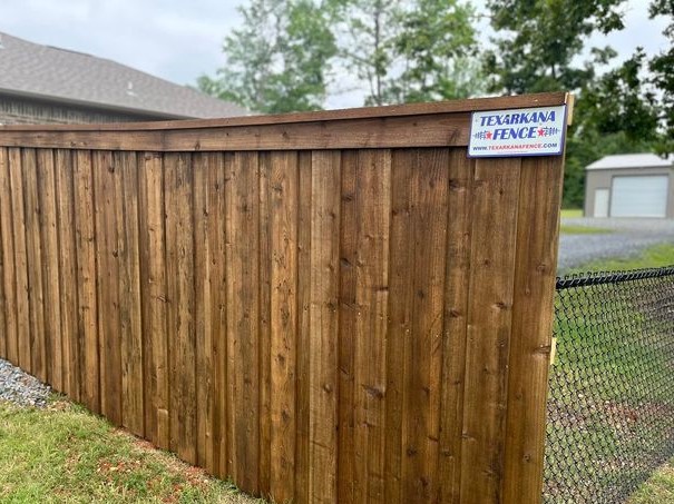 Wood capped privacy fence