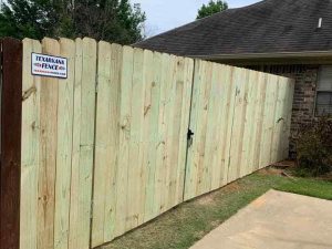Photo of a stockade side by side wood privacy fence