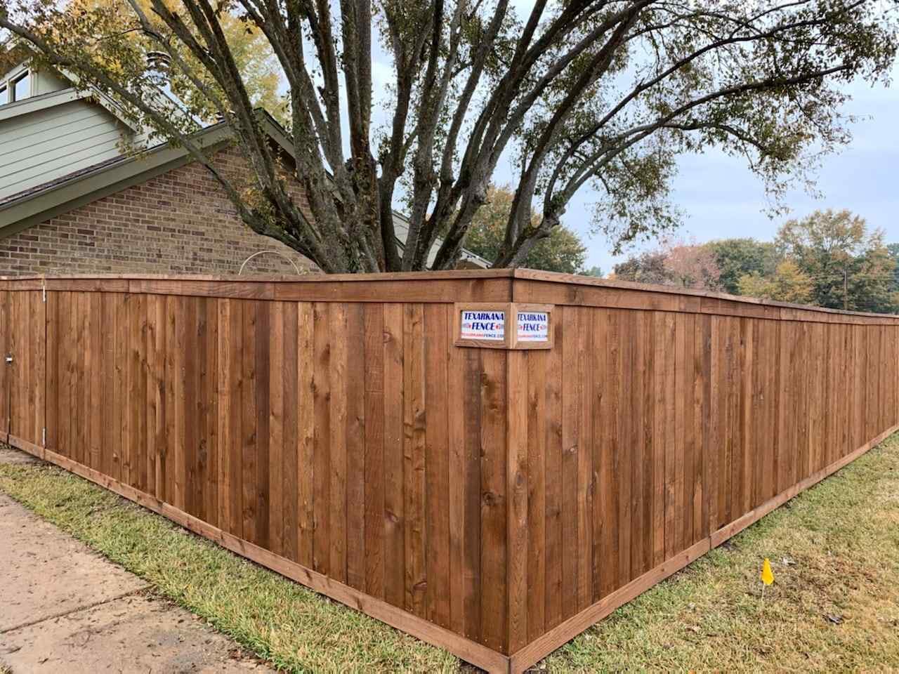 Photo of a residential pre-stained wood fence in Texarkana, Texas